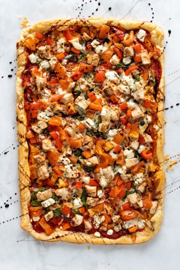 puff pastry pizza that has been drizzled with balsamic glaze